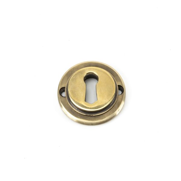 From the Anvil Aged Brass Round Escutcheon (Plain)